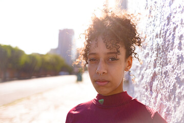 African American young woman portrait outdoors in urban landscape