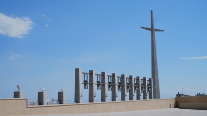 large cross with bells Sanctuary of Saint Pio of Pietrelcina, Italy
