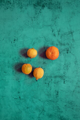 Still Life oranges composition in a blue stone background