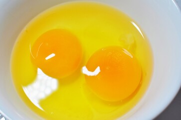 Raw eggs on the bowl
