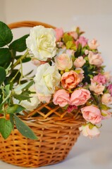 Bouquet of roses in a wicker basket, wedding decorations