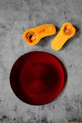 minimalistic still life raw pumpkin in a stone background