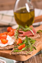 Crispy rye bread with sesame seeds, ham and cottage cheese.