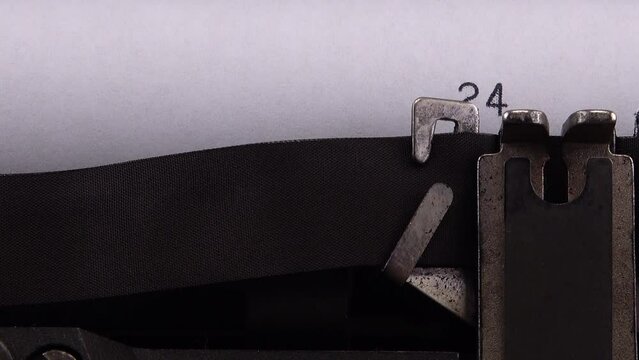 Typing phrase "24 February 2022" on retro typewriter.