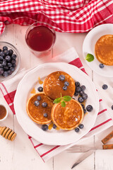 Pancakes with blueberries and chocolate cream.