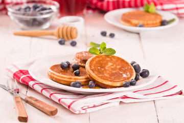 Pancakes with blueberries and chocolate cream.