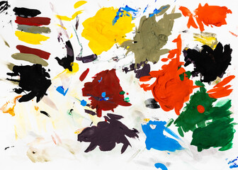 colorful artist pallete with hardened blots of tempera paints on white paper