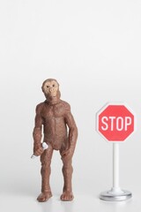 caveman with a stop sign miniature toy
