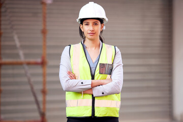 Building this city with my own hands. Shot of a young woman working on a construction site.