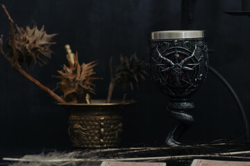 Satanic chalice for black mass preparation. dark background wallpaper.