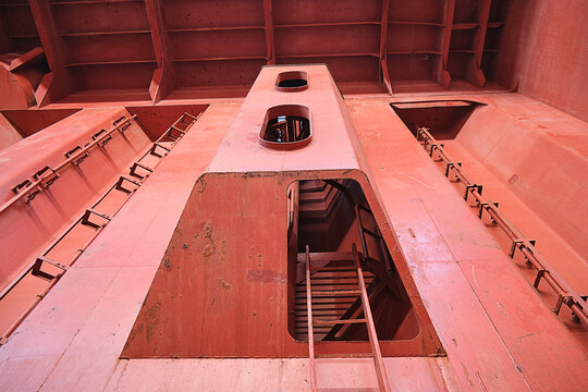 View of entrance to Australian, spiral ladder inside ship's cargo hold