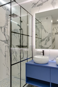 Modern bright bathroom with washbasins and large mirror with sub-heading