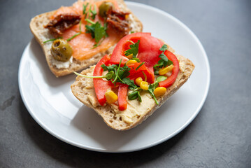 Tasty homemade breed with vegetable on stone background