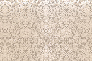 Vintage embossed satin beige background, cover design. Geometric artistic 3D pattern, ethnic texture. Creativity of the peoples of the East, Asia, India, Mexico, Aztecs, Peru in handmade style.