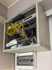 electrical equipment cabinet with tangled cables