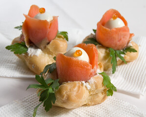 Toasts with red fish, herbs and egg