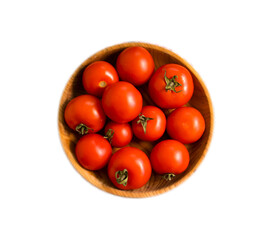 ripe tomatoes in a wooden plate isolated on white background