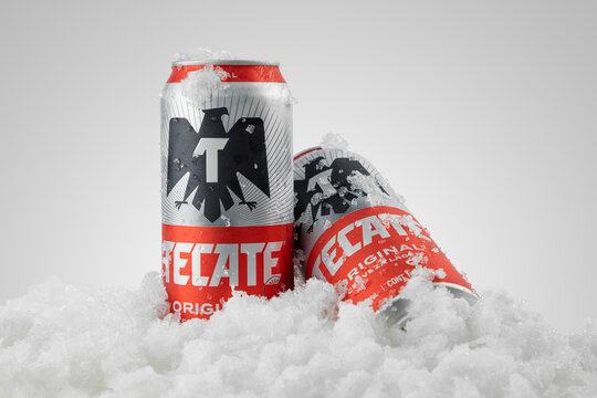 Mexico ,CDMX - April 08, 2022: Product photo of Tecate Beer with ice and white background, copy space