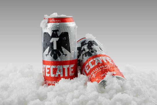 Mexico ,CDMX - April 08, 2022: Product photo of Tecate Beer with ice and white background, copy space