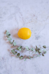  Still Life yellow and green lemons in a white stone background
