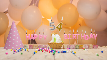 Beautiful background happy birthday number 54 with burning candles, birthday candles pink letters...