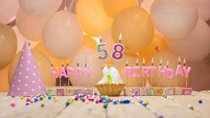 Beautiful background happy birthday number 58 with burning candles, birthday candles pink letters...