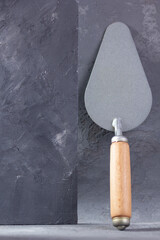 Construction trowel tool on cement  background. Mason tool