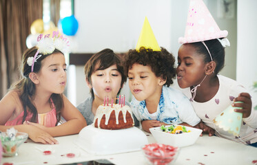 We love going to parties. Shot of four adorable kids celebrating together at a birthday party. - Powered by Adobe