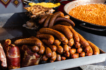 Fried sausages, pork and beans. Romanian traditional food.