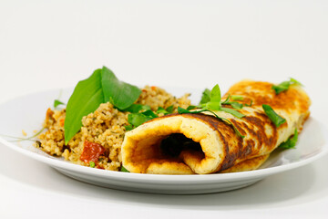 Wild garlic pan cake and couscous salad