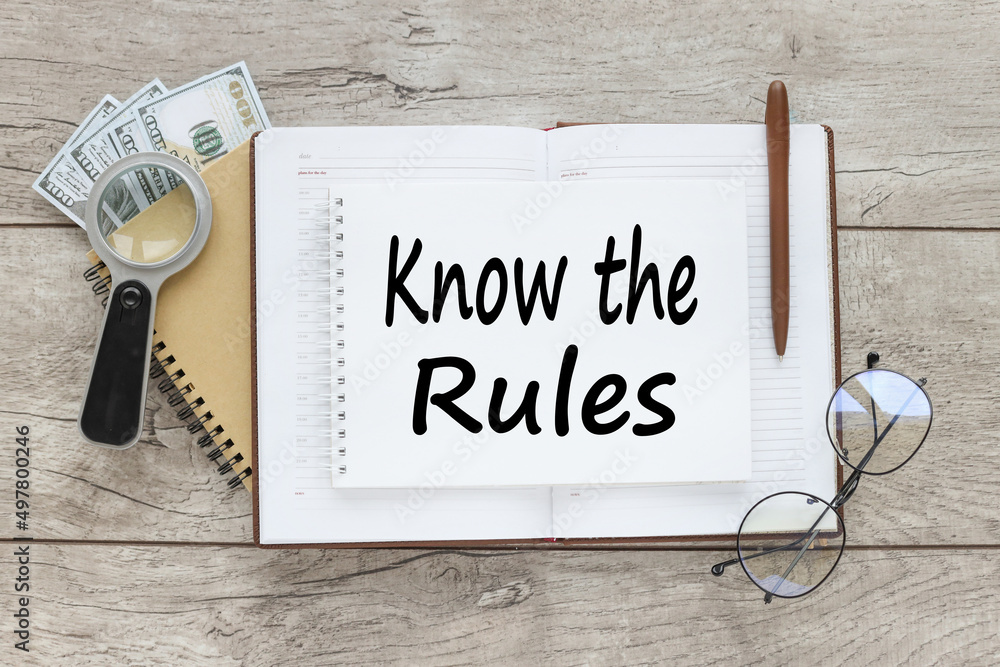 Poster know the rules. text on notepad on table near glasses. business process regulation concept.