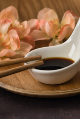 Close-up detail soy sauce and chopsticks