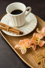 Coffee time with pastries on dark background