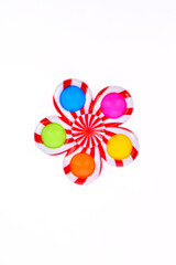Pop it silicone rainbow anti-stress toy isolated on white background. Simple dimple, popular modern stress relief toys for adults and children. Fidget kid toy, Pop Bubble Fidget.