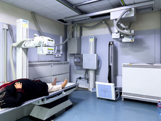 Unrecognizable woman having X-ray scanning session in a public hospital