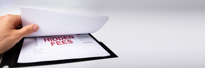 Person Looking At Hidden Fees In Contract