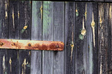old wooden colorful door rusted metal hinge