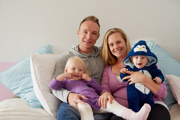 Kids bring so much warmth into a family. Portrait of a happy family spending quality time together at home.