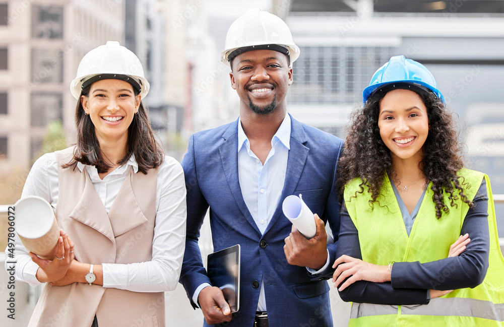 Poster were here to build. cropped portrait of three young engineers standing with blueprints on a construc