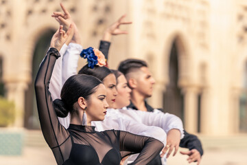 group of students from a flamenco school learning how to pose - obrazy, fototapety, plakaty