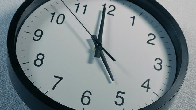 5 O'Clock Striking On Wall Clock Angled Shot