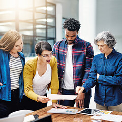 These drafts are looking quite accurate so far. Cropped shot of a group of creatives having a...