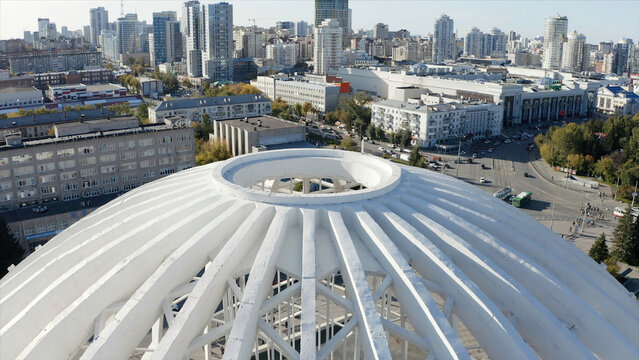 Aerial view of large and beautiful dome of the circus, Ekaterinburg, Russia. Stock footage. Residential buildings and beautiful office buildings on a summer day.
