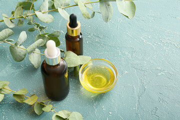 Natural eucalyptus essential oil on color background - obrazy, fototapety, plakaty