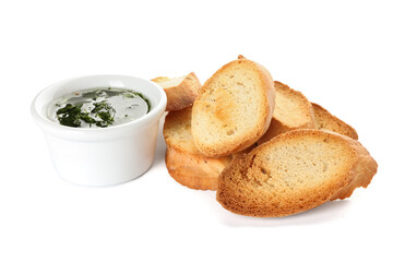 Fresh croutons and bowl with sauce isolated on white background
