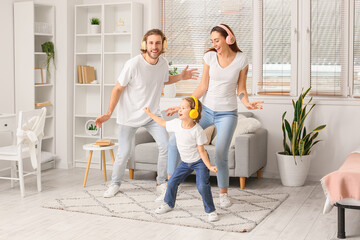 Happy young family listening to music at home