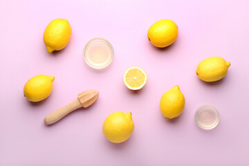 Composition with ripe lemons, wooden juicer and bowls of juice on color background