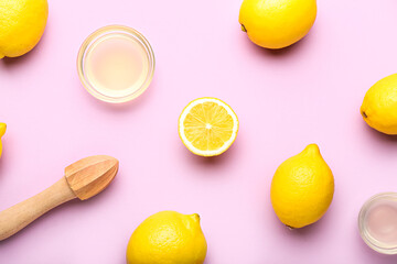 Composition with ripe lemons, wooden juicer and bowls of juice on color background