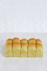 Green Pandan Japanese Milk Bread on a white background. Food Baking concept Fresh baked organic homemade soft milk loaf bread.	
