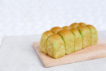 Green Pandan Japanese Milk Bread on a white background. Food Baking concept Fresh baked organic homemade soft milk loaf bread.	
